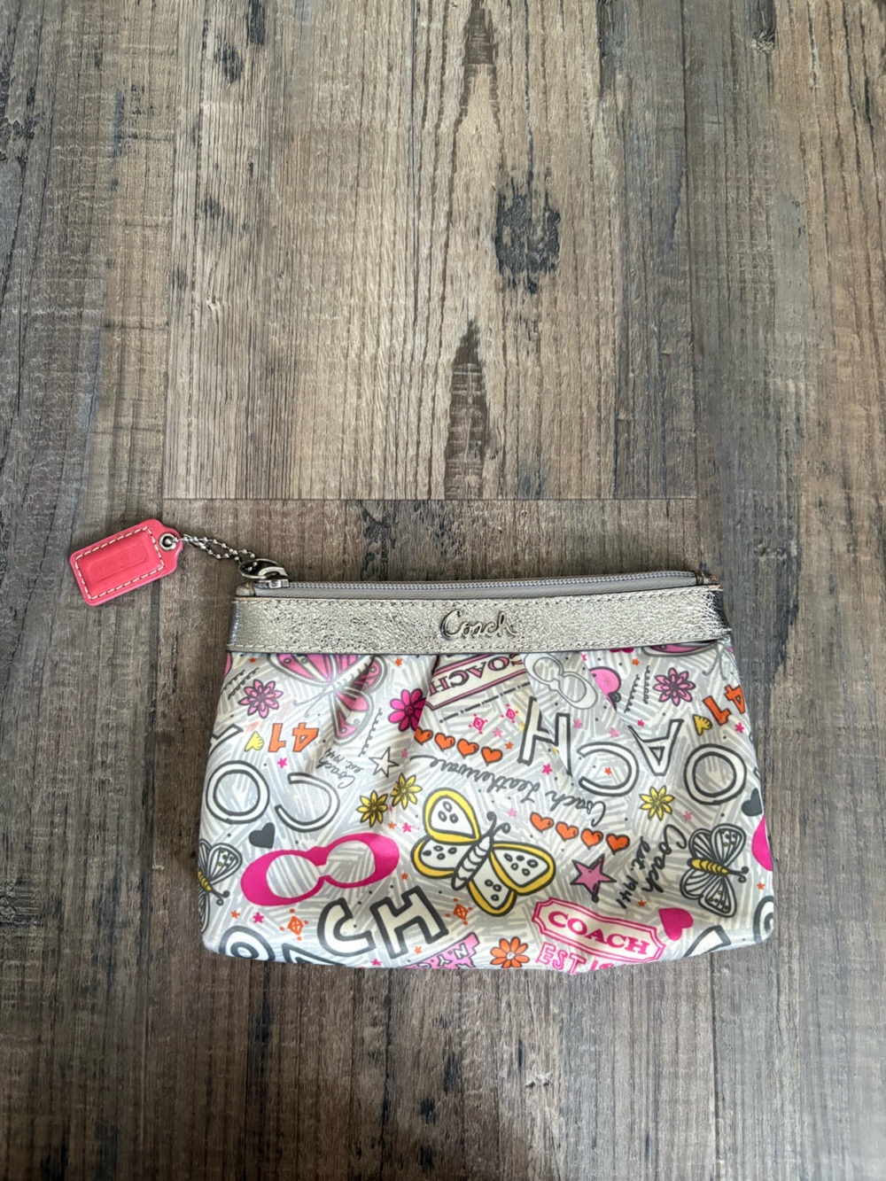 Coach Poppy Butterfly graffiti wristlet